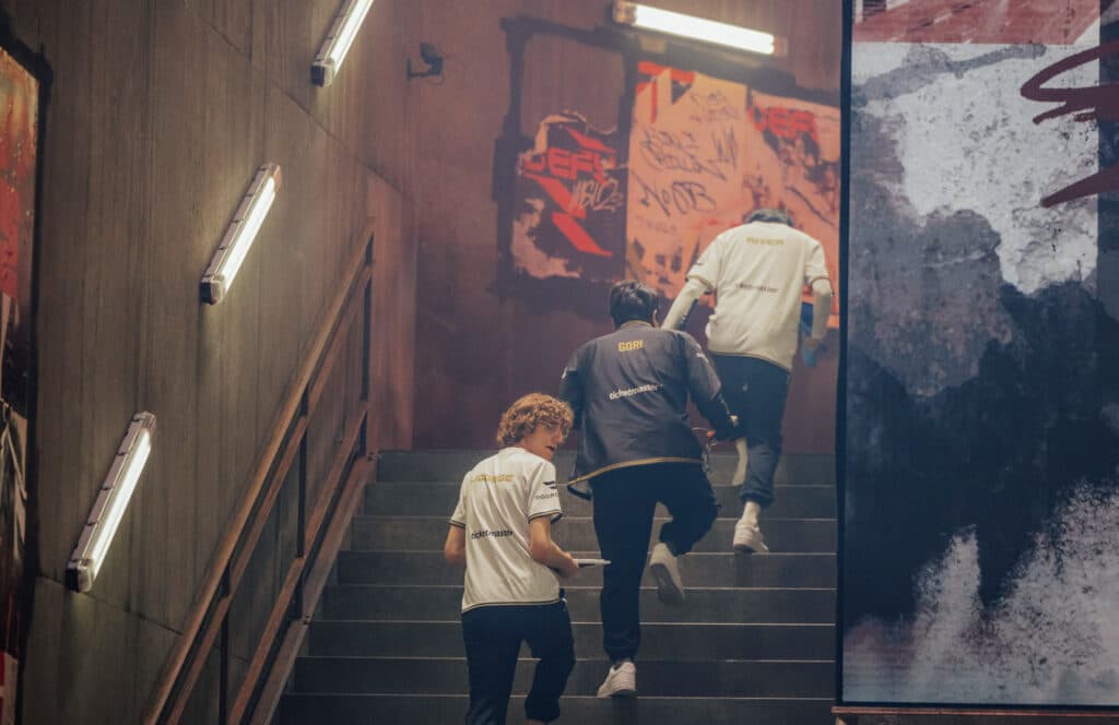 GG between matches walking backstage (Image via Colin Young-Wolff and Riot Games)